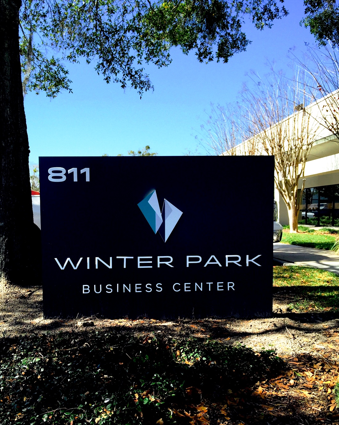 A sign outside Winter Park Business Center.